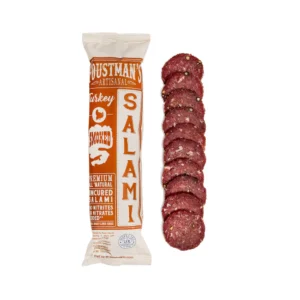 Foustmans Smoked Tyrkey Salami in package next to sliced salami